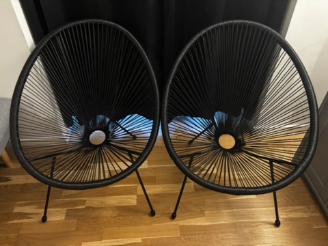 Two black Acapulco garden chairs